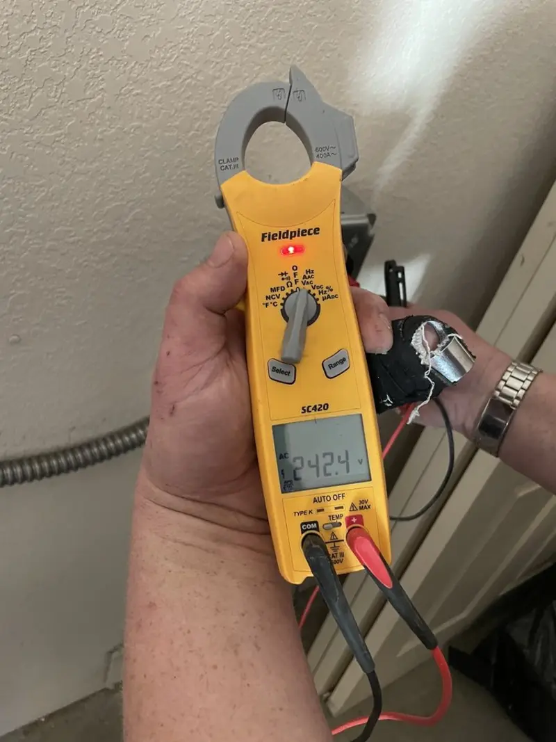 Voltage testing with clamp meter during Electrical Installation Services in Crossville